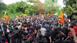 Sri Lankan university students shout slogans after being hit with water cannons and tear gas as they tried to break through the barricades that led to parliament demanding immediate resignation of president and government at Colombo, Sri Lanka. 06 May 202