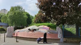 Pareidolia in Paris suburb. Rock face with two hands. Rue Gabriel Peri, Ivry-sur-Seine, France. 8 may 2022
