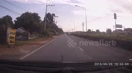 Motorcycle rider loses balance while carrying door frame