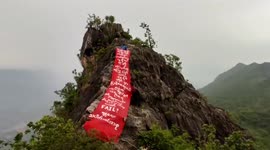 Burmese protesters hang anti-coup banner on 3,000ft-tall mountain