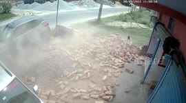 Chilling moment speeding car hits pile of bricks in northern India