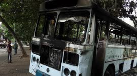 Burned-out buses on Colombo streets after violent protests