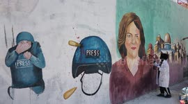 Palestine artists paint mural depicting late Al Jazeera journalist Shireen Abu Akleh