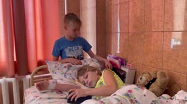 Young boy takes care of twin sister and mother who lost legs in horrifying Kramatorsk train station airstrike