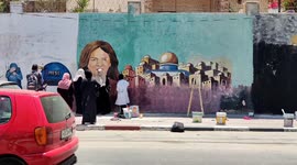 Artists paint mural dedicated to Al Jazeera journalist killed during Israeli raid