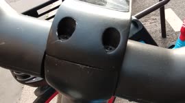 Pareidolia in Paris. Dott shareable bikes handlebar. Rue Jacques Bingen. 12 may 2022.