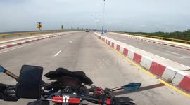 Motorbike riders flung to the ground while trying to overtake in Thailand