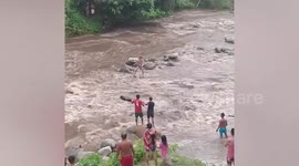 Hero locals save tourist who fell into raging river 'while taking selfie'