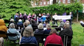 Sue Gilmurray and Raised Voices choir perform at the International Conscientious Objectors' Day, London, UK