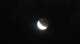 Drifting clouds add dramatic effect to total lunar eclipse