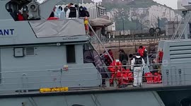 Migrants arrive in Dover after being picked up in the English Channel