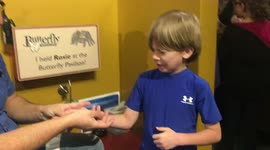 Boy holds tarantula