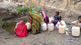 Women brave heatwave and walk miles in search of drinking water in central India