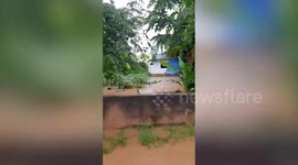 Mountain run-off inundates village with muddy flood water in Thailand