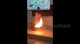 Uni teacher shows how to extinguish fire on gas tank