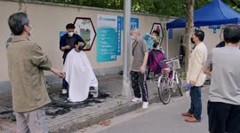 Chinese people use exit passes to gather outside during lockdown