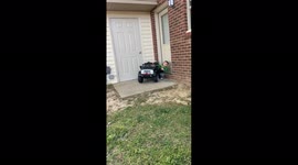 Confused boy falls out of toy truck after putting it in reverse