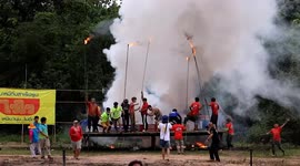 Giant spinning rocket blasts into sky during Thai Buddhist festival