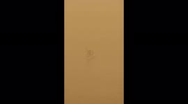 Fishermen float down the Tigris river in Baghdad during its latest Sandstorm