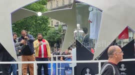 Fans take pictures with Champions League trophy ahead of final in Paris