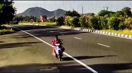 A CCTV footage showing a car in South India hit the road median and flew for 20 meters travellers survived with injuries