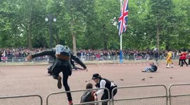 Queen’s jubilee parade shows protesters storming onto the mall before being dragged away by police