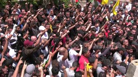 Mourners carry the flag-draped body of Palestinian Bilal Kabha, killed during clahes with Israeli troops in the town of Yabad near Jenin a day earlier, during his funeral in the same town