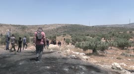 Palestinian protesters clash with Israeli forces during a demonstration against settlements in the village of Beita in the West Bank