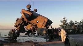 Russian helicopter wreckage pulled out of Kyiv reservoir as cleanup efforts continue