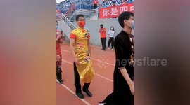 Male teachers wear traditional dresses during catwalk show for students in China