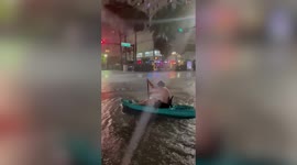 Kayaking through the flooded streets of Miami after a massive rain storm