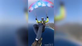 Paraglider rescued after his parachute got tangled forcing him to land on water