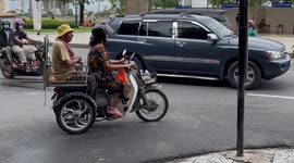 Elderly man transported in modified seat on motorcycle