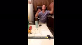 Man dances in kitchen