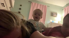 Baby pushes parents head down
