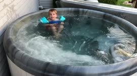 Toddler whirls in whirlpool