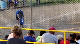 Boy runs for second base