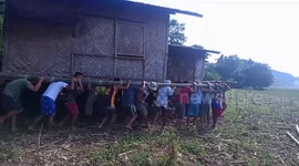 More than fifty villagers lift entire wooden house to help neighbour move