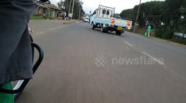Motor cycle ride through the suburbs of Eldoret town specifically Kapsoya Illula road with full moon at the backdrop