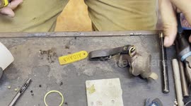 Craftsman makes leather elephant key rings with personalised name tags