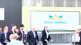 Boris Johsons on his way out of the cattle shed meets visitors to the Royal Cornwall Show, followed by the parade of Cattle