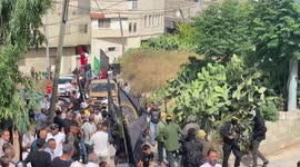 Mourners carry the body Palestinian Samih Amarneh, 37, during his funeral in the town of Yamun