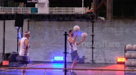 Freestyle basketball players perform incredible tricks on floating court in the River Thames