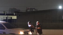 Harris County Constables detain a man on the Westpark Tollway in Houston