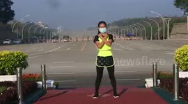 Fitness instructor records aerobics while military coup unfolds behind her in Myanmar