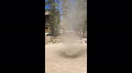 Dramatic dust devil spinning just a few feet from Colorado resident