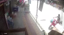 Motorcycle smashes through shop after driver 'faints due to heat'