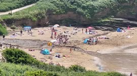 Locals head to Devon beach as UK enjoys its hottest day of year
