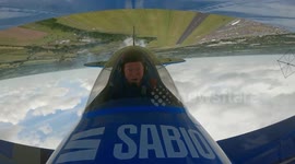Retired RAF pilot pulls stunts in an aerobatic biplane he built in his garden shed