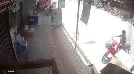 Motorcycle smashes through shop after driver 'faints due to heat'